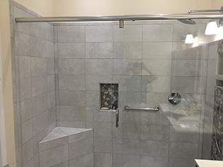 Custom frameless shower enclosure installation by Design Glass & Mirror - example 1